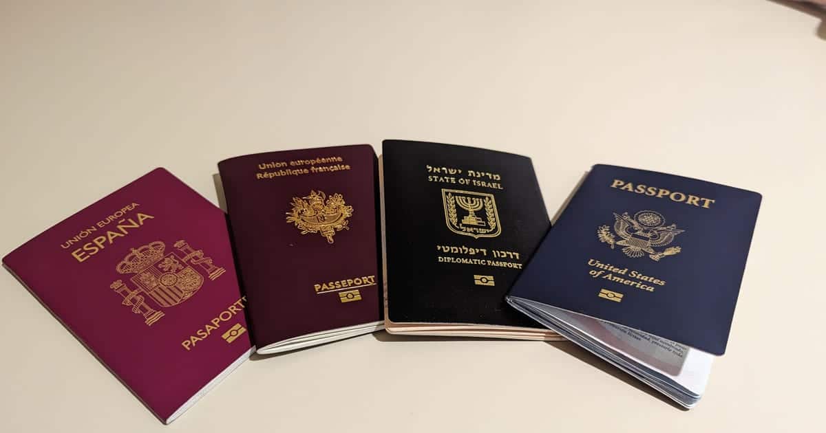 Four passports from different countries laid on a table