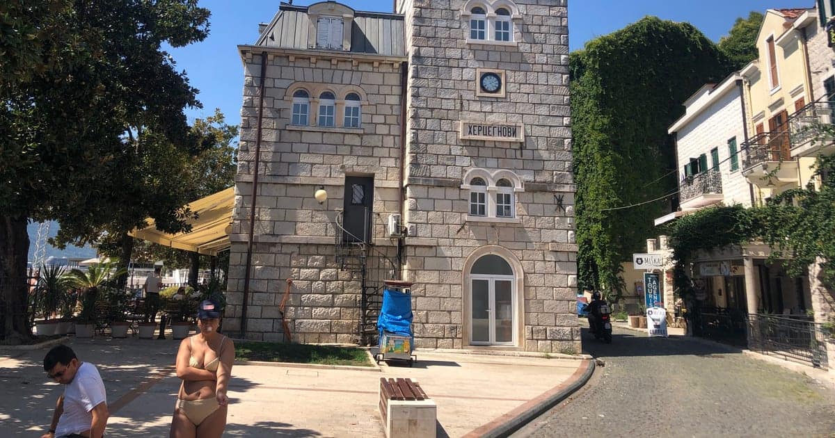 Stone clock tower street in the old town of Herceg Novi